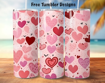 May include: Three tumblers with a pink heart design. The tumblers are covered in various shades of pink hearts, with the words "Free Tumbler Designs" at the top. The background is a beach scene.