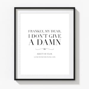 Op de afbeelding: Zwart-witte printbare quote-kunst met de tekst "Eerlijk gezegd, mijn schat, het kan me niet schelen." met de toeschrijving "Rhett Butler, Gone With The Wind, 1939".
