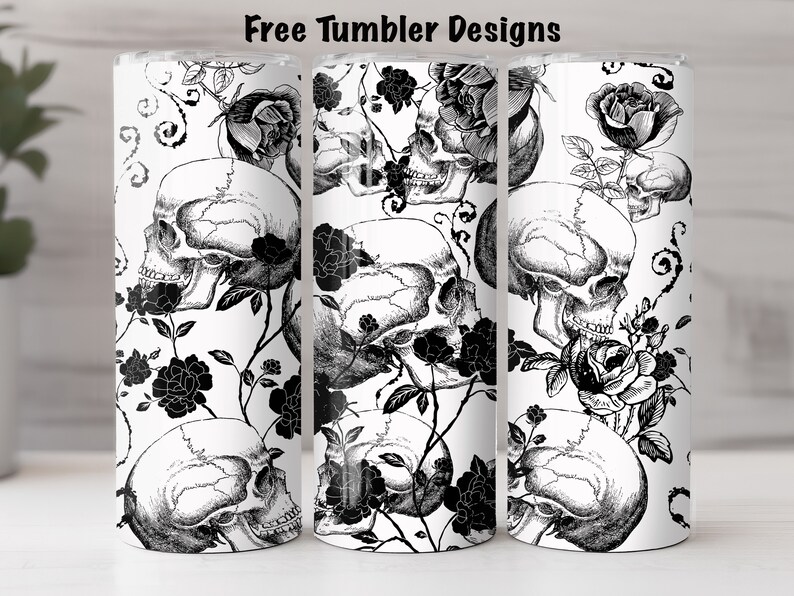 May include: Three white tumblers with a black and white design of skulls and roses. The design is repeated on each tumbler.