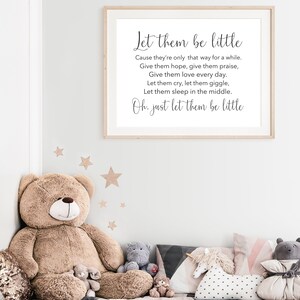 May include: A framed print with a white background and black text that reads "Let them be little. Cause they're only that way for a while. Give them hope, give them praise, Give them love every day. Let them cry, let them giggle, Let them sleep in the middle. Oh, just let them be little."