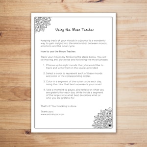 May include: Black and white printable worksheet with instructions on how to use a moon tracker to track moods. The worksheet includes a large circle divided into segments and smaller circles for recording moods.