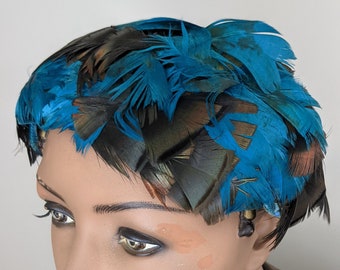 Vintage 1950s, Turquoise & Iridescent Black Feather Hat. Shiny, Colorful Feather Fascinator Hat. Feathers completely cover a flexible frame.