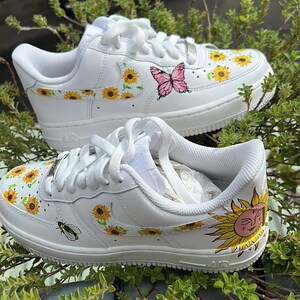 white nike sandals with sunflowers