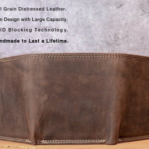 May include: A brown, distressed leather wallet with white stitching around the edges. The wallet has a slim design and appears to have a large capacity. The text on the image reads: Full Grain Distressed Leather, Slim Design with Large Capacity, RFID Blocking Technology, Handmade to Last a Lifetime.
