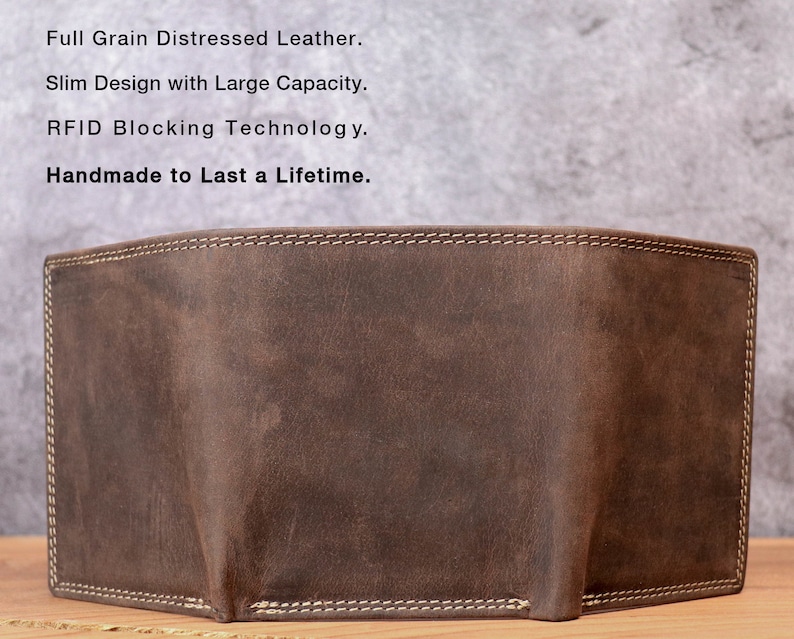 May include: A brown, distressed leather wallet with white stitching around the edges. The wallet has a slim design and appears to have a large capacity. The text on the image reads: Full Grain Distressed Leather, Slim Design with Large Capacity, RFID Blocking Technology, Handmade to Last a Lifetime.