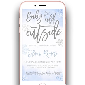 May include: A blue and white baby shower invitation with snowflakes and the text "Baby it's cold outside". The invitation is for Olivia Romero and includes the date, time, and location of the shower. It also includes the text "Registered at Buy Buy Baby and Target".