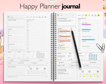 May include: A black and white printable Happy Planner journal with a daily planner layout. The journal includes sections for daily goals, to-do lists, meal planning, and mood tracking. The journal is available in A5 double, A5, A4, and US letter sizes.