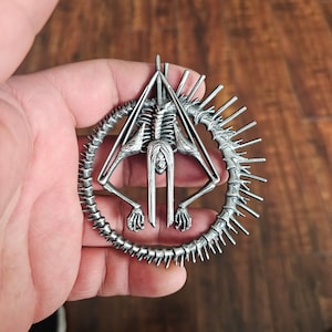 Ivory Ouroboros Pin/Decal by The Rising King TRK LLC
