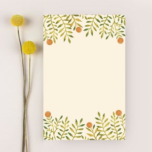 May include: A blank card with a green and brown leafy border. The border is made up of small branches with leaves and small orange circles.
