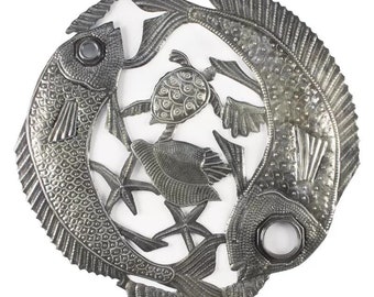 May include: A metal wall art piece depicting two fish, a turtle, and starfish. The piece is made of cut and welded metal and has a silver finish.