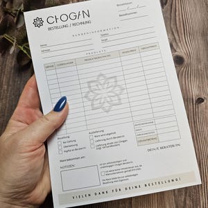 May include: A white order form with the company name "CHOGAN" printed at the top. The form includes sections for customer information, product details, payment options, and delivery preferences. The form also includes a section for the customer's consultant's information.
