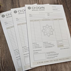 May include: Three white order forms with black text and a black and white logo for Chogan. The forms have sections for customer information, product details, payment, and shipping. The forms have the text "BESTELLUNG/RECHNUNG" and "VIELEN DANK F&Uuml;R DEINE BESTELLUNG!"