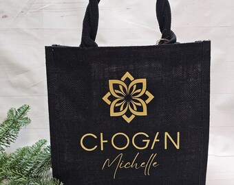 May include: Black jute tote bag with a gold logo and the text "CHOGAN Michelle".