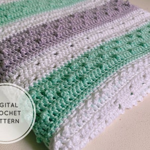 May include: A crochet baby blanket with stripes of white, light green, and lavender yarn. The blanket is made with a textured stitch and has a "DIGITAL CROCHET PATTERN" label.