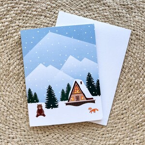 Cartão Cabana Nevada | 4,25” x 5,5” Montanhas Inverno Maravilhas Cabana Bosque Natureza Animais Presente Bonito Natal Feriado