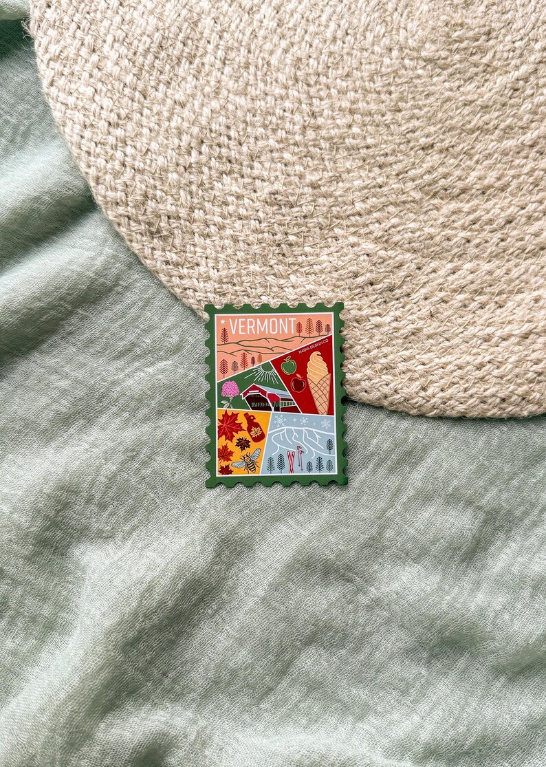 May include: A green Vermont-themed sticker with a postage stamp design. The sticker features illustrations of landscapes, an apple, an ice cream cone, a covered bridge, and the word "VERMONT" at the top.
