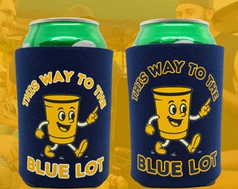 May include: Two navy blue can coolers with a yellow cartoon cup design. The design includes the text "THIS WAY TO THE BLUE LOT". The can coolers are holding green cans.