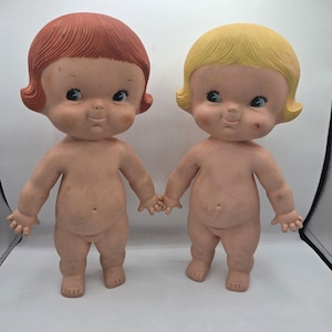 May include: A set of three ceramic mugs with a speckled, matte finish. The mugs are in shades of cream, light gray, and dark gray. Each mug has a simple, minimalist design, perfect for coffee or tea.