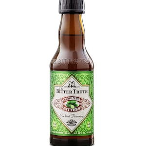 May include: A brown glass bottle of The Bitter Truth Cucumber Bitters. The label is green and white with the text "Cucumber Bitters Cocktail Flavoring". The bottle contains 200 ml and is 39% alcohol by volume.
