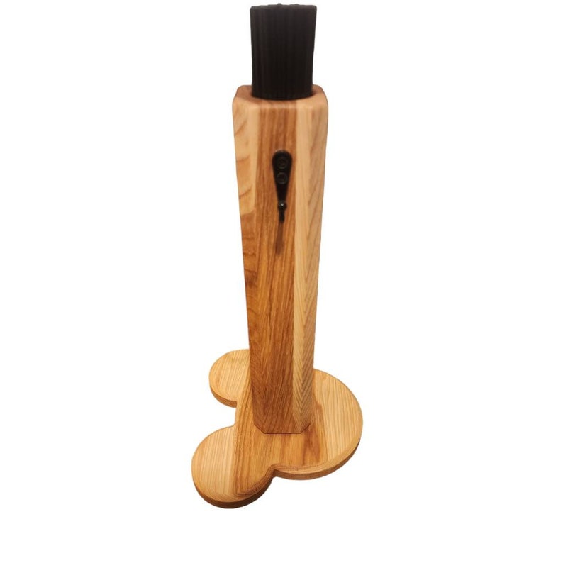 May include: Wooden shoe brush with a black bristle brush and a Mickey Mouse shaped base.