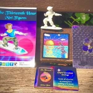 May include: A collection of items related to "The Thirteenth Hour" including a mini figure, a patch, a card, and a booklet. The booklet features a character on a surfboard with the text "Logan" and "Ages 3+ 13thhr.word". The patch features a sunset scene with a character on a surfboard. The card features a character in a purple robe with the text "The Thirteenth Hour Joshua Blum Digital Download Package Inside all of us lies an unsung hero waiting to be found. Find yours today!"