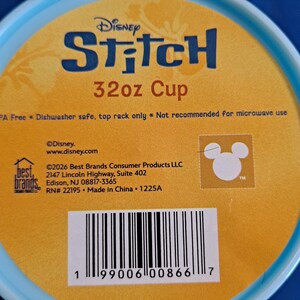 May include: A blue and yellow Disney Stitch 32oz cup. The cup features the Disney Stitch logo and the text "32oz Cup". The cup is BPA free and dishwasher safe. The cup is not recommended for microwave use.