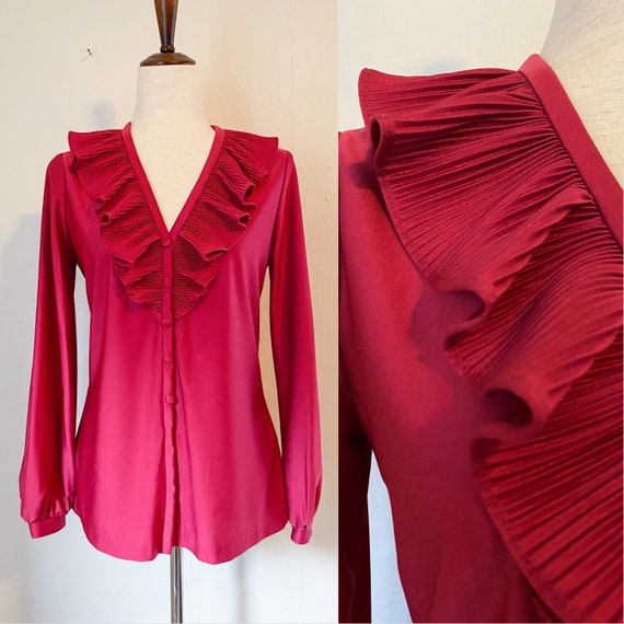 Ruffled fuchsia and multi-color cap sleeve women’s blouse.