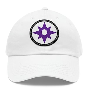 May include: White baseball cap with a purple and white starburst patch on the front.