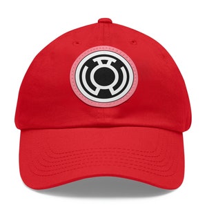 May include: A red baseball cap with a pink and black Green Lantern symbol on the front.