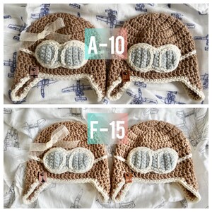 May include: Two brown crocheted aviator hats with white faux fur trim and blue felt goggles. The hats are labeled "A-10" and "F-15".