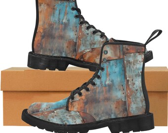 May include: A pair of combat boots with a distressed metal design. The boots feature a mix of blue, brown, and orange hues, with black laces and soles. The boots are displayed on a brown cardboard box.