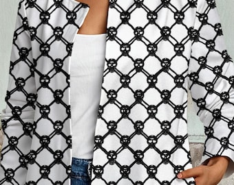 May include: A long-sleeved, open-front jacket featuring a repeating black and white lattice pattern with small skull icons at each intersection. The jacket has a round neckline and two side pockets, worn over a white top and blue denim jeans.