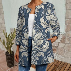May include: A blue and cream floral patterned jacket with an open front and three-quarter sleeves. The jacket features pockets and is worn with blue jeans and a white top. The jacket's length is approximately 76 cm.