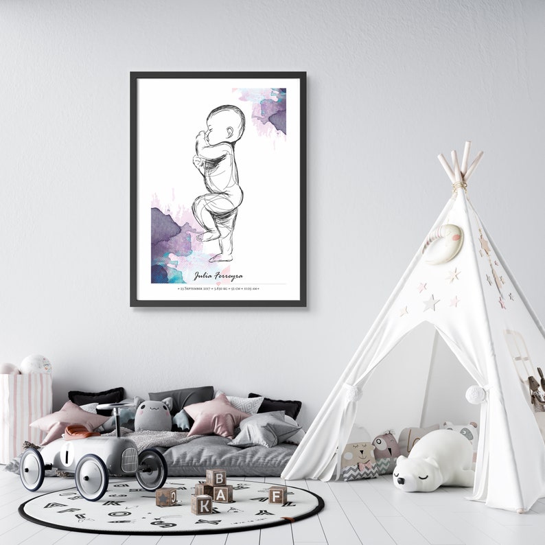 May include: A black and white line drawing of a baby standing with a watercolor background in shades of pink, purple, and blue. The name "Julia Ferreyra" is printed below the drawing.