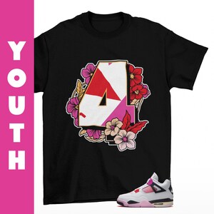 May include: A black short-sleeve t-shirt featuring a large graphic of the number 4 in white, red, and pink, surrounded by a floral arrangement of pink, red, and beige flowers. The word YOUTH is printed vertically in white on a pink side bar.