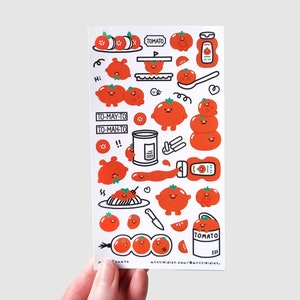 Puede incluir: Una hoja de pegatinas con tem&aacute;tica de tomate con tomates de dibujos animados, botellas de ketchup y rodajas de tomate. Las pegatinas son rojas, blancas y negras. El texto incluye "TOMATO", "TO-MAY-TO" y "TO-MAH-TO".