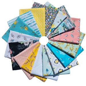 May include: A collection of 18 fabric squares with various patterns, including lemons, flowers, stripes, and geometric designs. The fabrics are in shades of blue, yellow, pink, and white.