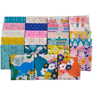 May include: A collection of folded fabric squares with various patterns. Designs include hearts, flowers, typewriters, and ice cream cones in shades of pink, blue, yellow, and white. The fabrics are stacked in rows.