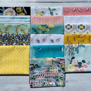 May include: A set of 15 fabric squares featuring various patterns, including floral, geometric, and nautical themes. The fabrics are in shades of blue, green, yellow, pink, and white.