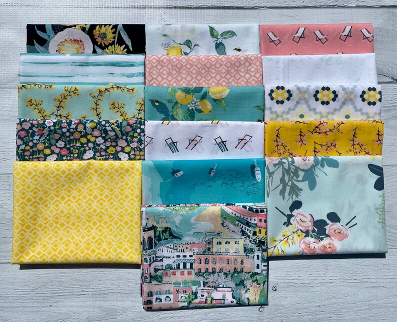 May include: A set of 15 fabric squares featuring various patterns, including floral, geometric, and nautical themes. The fabrics are in shades of blue, green, yellow, pink, and white.