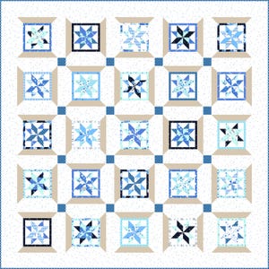 May include: A patchwork quilt featuring a repeating pattern of star-shaped blocks in shades of blue and white. Each block is framed in a light beige color, with a white background speckled with tiny dots. The quilt has a blue border.
