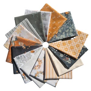 May include: A collection of folded fabric squares arranged in a circular pattern. The fabrics feature various nature-inspired patterns in shades of green, orange, yellow, and gray. Designs include floral, geometric, and striped motifs, suitable for quilting or crafting projects.