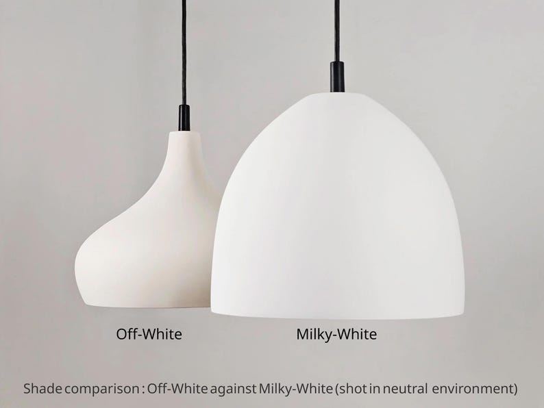 May include: Two white pendant lights with black cords and fixtures. One is a teardrop shape, the other a rounded dome. Text reads "Off-White" and "Milky-White" for shade comparison.