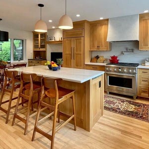 Naaya Dome terracotta ceramic pendant lights kitchen island warm wood cabinets dining room open plan handmade clay dome plug in Naaya Studio