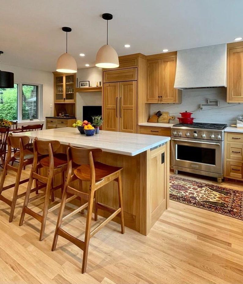Naaya Dome terracotta ceramic pendant lights kitchen island warm wood cabinets dining room open plan handmade clay dome plug in Naaya Studio