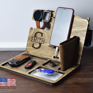 May include: Wooden organizer with multiple compartments for holding a phone, wallet, watch, keys, and other small items. The organizer is personalized with the name "SMITH".