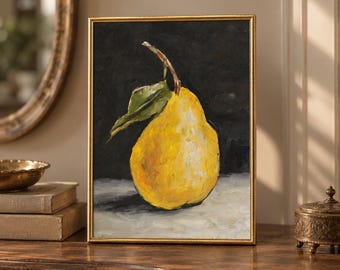 May include: A framed oil painting featuring a single bright yellow pear with a green leaf and stem, set against a dark black background and resting on a light-colored surface, enclosed in a thin gold-colored rectangular frame.