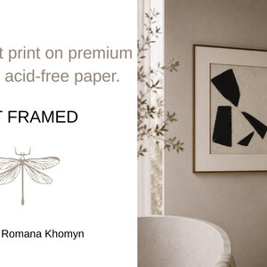May include: An unframed art print featuring an abstract design of black shapes on a beige background, displayed in a room with neutral tones. The print is on 189 g/m&sup2; acid-free paper. The artist is Romana Khomyn.