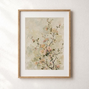 May include: A framed floral print depicting a branch with pink and yellow blossoms and green leaves. The artwork is set against a textured, muted background with a light wooden frame. The print has a vintage aesthetic.