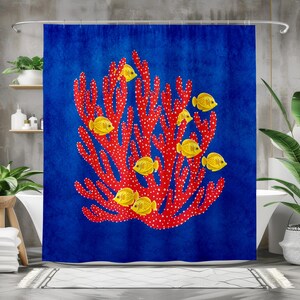 May include: A shower curtain featuring a deep blue background with a large, central red coral structure covered in white spots. Several bright yellow fish are positioned throughout the branches of the coral, creating a vibrant underwater scene.